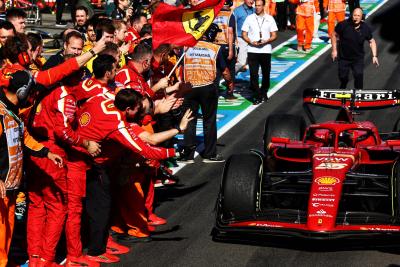 Race winner Carlos Sainz Jr (ESP) Ferrari SF-24 passes the team as he enters parc ferme at the end of the race. Formula 1